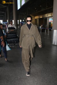actress Sonam Kapoor stylish in a brown overcoat at airport