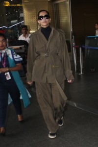 actress Sonam Kapoor stylish in a brown overcoat at airport