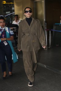 actress Sonam Kapoor stylish in a brown overcoat at airport