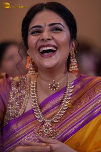 anchor and actress sreemukhi beautiful in a yellow and pink saree
