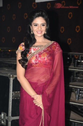 Telugu Actress Sreemukhi in a red saree