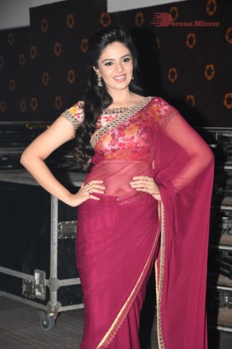 Telugu Actress Sreemukhi in a red saree