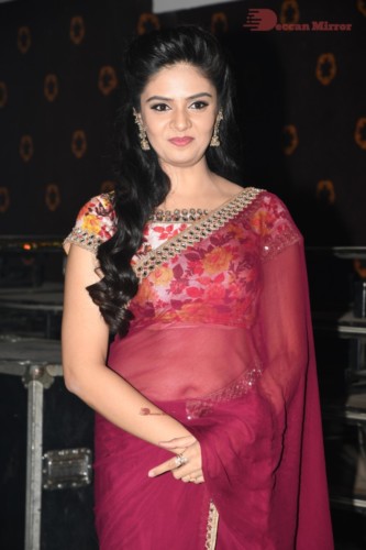 Telugu Actress Sreemukhi in a red saree