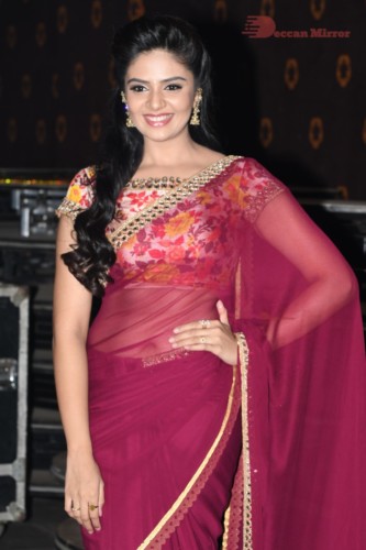 Telugu Actress Sreemukhi in a red saree