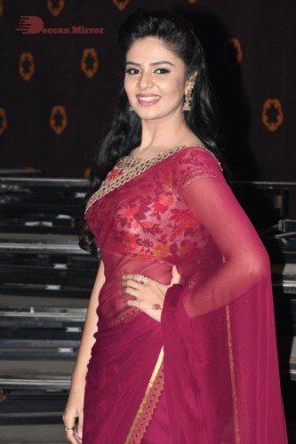 Telugu Actress Sreemukhi in a red saree