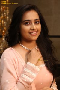 actress sri divya cute photo shoot in a pink salwar dress