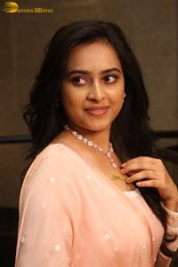 actress sri divya cute photo shoot in a pink salwar dress