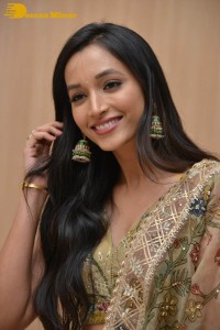 Actress Srinidhi Shetty in a gold color Lehenga Choli while attending the Pre-release function of the movie KGF Chapter 2