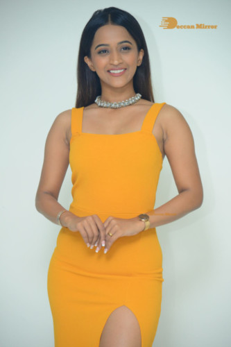 Telugu Actress Sruthi Shetty in a yellow dress