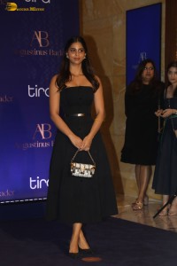 srk daughter and actress Suhana Khan in a black dress at an event