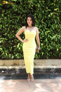 Indian actress Sunny Leone in a shoulderless yellow dress