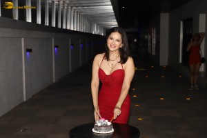 indian actress sunny leone glamorous look in a shoulderless red dress