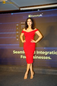 actress Sunny Leone beautiful in a red dress at an event