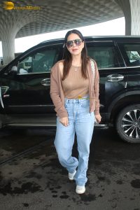 actress Sunny Leone gorgeous in a brown top and blue denim jeans