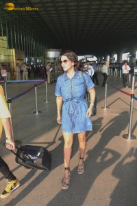 Sunny Leone in a denim dress at Mumbai Airport