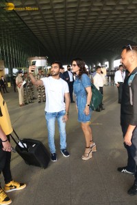 Sunny Leone in a denim dress at Mumbai Airport