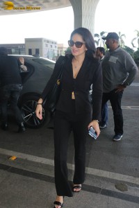 actress sunny leone in a black pant suit at airport