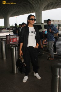 actress surveen chawla in black track suit at airport