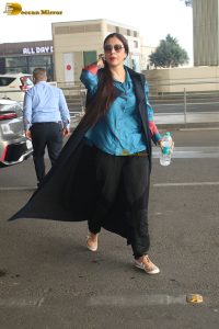 actress tabu in blue short and black pants