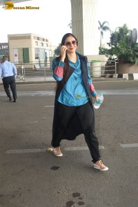 actress tabu in blue short and black pants