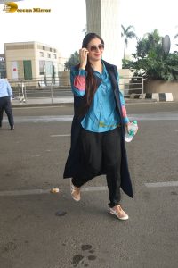 actress tabu in blue short and black pants