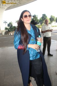 actress tabu in blue short and black pants