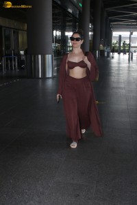 Tamannaah Bhatia sexy looks in a tiny red blouse at mumbai airport