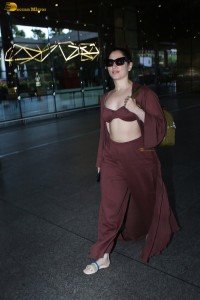 Tamannaah Bhatia sexy looks in a tiny red blouse at mumbai airport