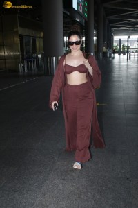 Tamannaah Bhatia sexy looks in a tiny red blouse at mumbai airport