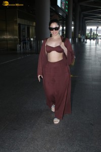 Tamannaah Bhatia sexy looks in a tiny red blouse at mumbai airport