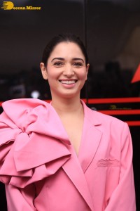 Actress Tamannaah Bhatia in a pink pant suit dress
