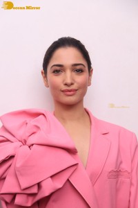 Actress Tamannaah Bhatia in a pink pant suit dress