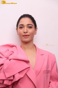 Actress Tamannaah Bhatia in a pink pant suit dress