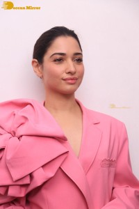 Actress Tamannaah Bhatia in a pink pant suit dress