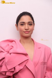 Actress Tamannaah Bhatia in a pink pant suit dress