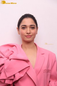 Actress Tamannaah Bhatia in a pink pant suit dress