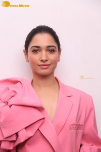 Actress Tamannaah Bhatia in a pink pant suit dress