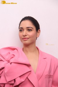 Actress Tamannaah Bhatia in a pink pant suit dress