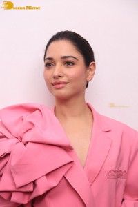 Actress Tamannaah Bhatia in a pink pant suit dress