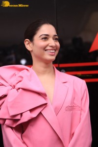 Actress Tamannaah Bhatia in a pink pant suit dress