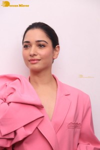 Actress Tamannaah Bhatia in a pink pant suit dress