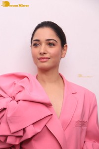 Actress Tamannaah Bhatia in a pink pant suit dress