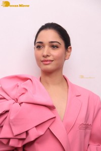 Actress Tamannaah Bhatia in a pink pant suit dress