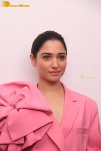 Actress Tamannaah Bhatia in a pink pant suit dress