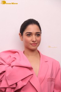 Actress Tamannaah Bhatia in a pink pant suit dress