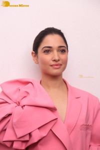 Actress Tamannaah Bhatia in a pink pant suit dress
