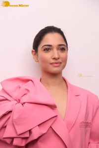 Actress Tamannaah Bhatia in a pink pant suit dress