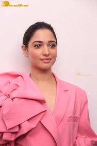 Actress Tamannaah Bhatia in a pink pant suit dress