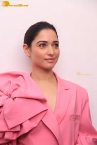 Actress Tamannaah Bhatia in a pink pant suit dress
