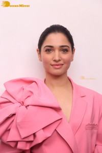 Actress Tamannaah Bhatia in a pink pant suit dress